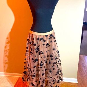 Fun, kicky skirt is pink and black. It’s great with boots! Sz. XL